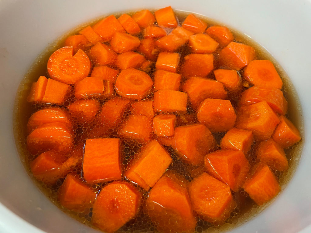 air fryer glazed carrots in a soaking bowl