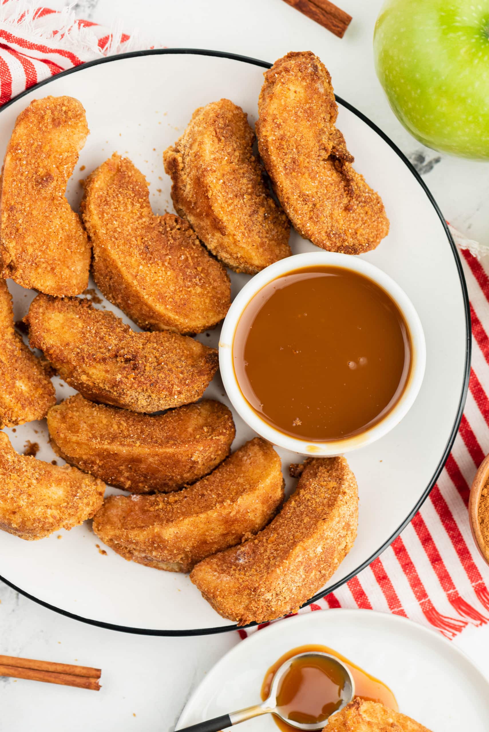 Air Fryer Apple Fries on a plate with dipping sauce by Air Fryer Fanatics 